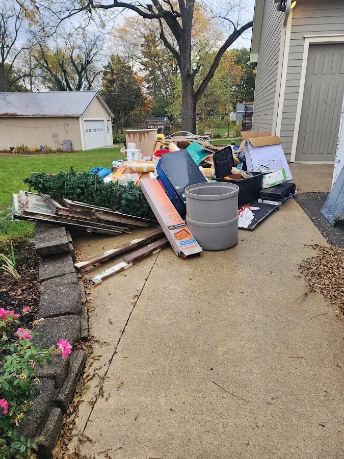 Dumpster being loaded with debris for Commercial Dumpster Rental in Conestoga